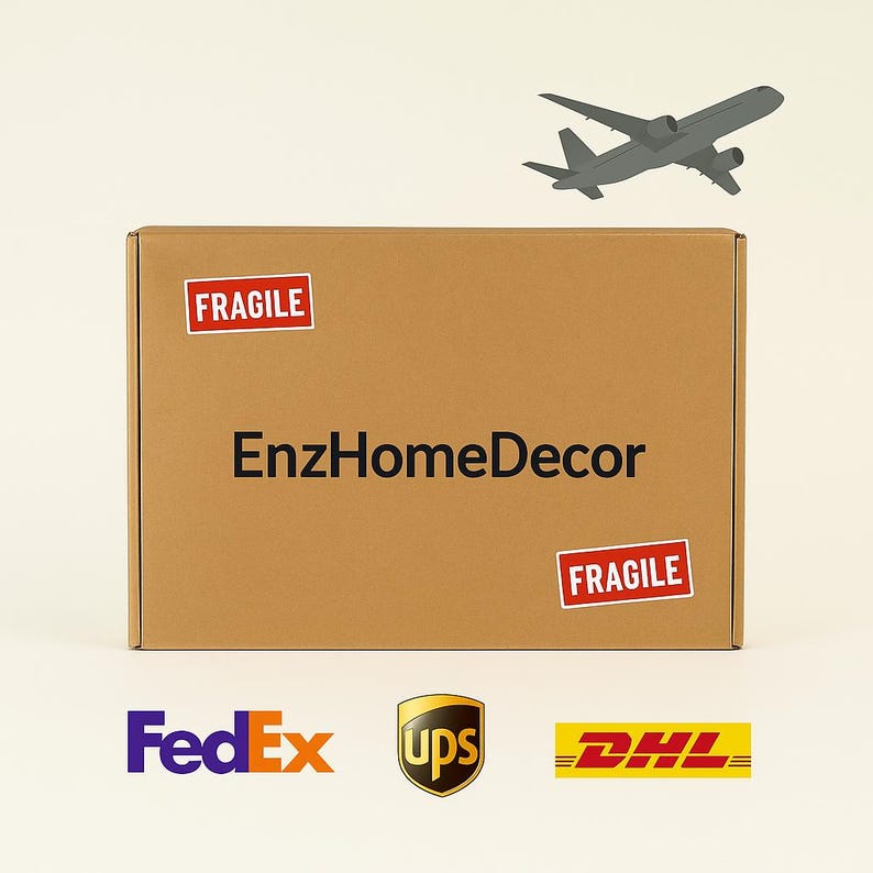 May include: A rectangular brown cardboard shipping box featuring the black text EnzHomeDecor centered on the front. Two red and white rectangular stickers labeled FRAGILE are attached to the box. A gray airplane icon and the logos for FedEx, UPS, and DHL.