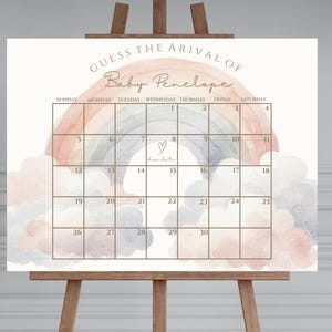 May include: A printable baby shower game featuring a rainbow and cloud design. The game is titled "Guess the Arrival of Baby Penelope" and includes a calendar with days of the week and numbers 1 to 30.