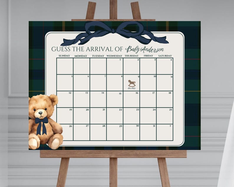 May include: A baby shower guessing game sign with a calendar grid, a navy blue bow, and a teddy bear. The sign reads "GUESS THE ARRIVAL OF Baby Anderson" and includes a calendar grid for guests to write their guesses. The background has a plaid pattern.