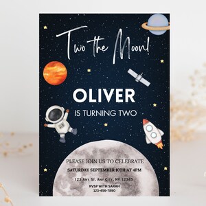 May include: A blue and black space-themed birthday invitation with a rocket, astronaut, planets, and stars. The text reads "Two the Moon! Oliver is turning two. Please join us to celebrate Saturday September 10th at 4pm 123 Any St. Any City, NY 12345 RVSP with Sarah 123-456-7890"