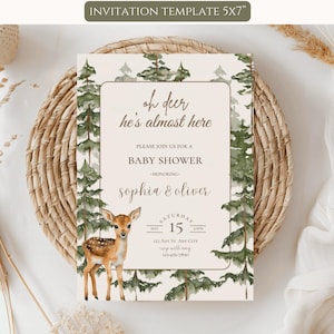 May include: A 5x7 inch baby shower invitation template featuring a watercolor illustration of a fawn and pine trees. The text reads: oh deer he's almost here, PLEASE JOIN US FOR A BABY SHOWER, HONORING, sophia & oliver, SATURDAY MAY 15, 123 ANY ST, ANY CITY.
