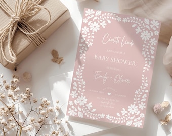 May include: Pink baby shower invitation with a white floral border and the text "Ciecito Linda" and "Join us for a Baby Shower honoring Emily & Oliver".