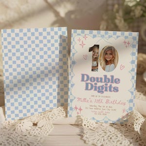 May include: A birthday invitation with a light blue and white checkered pattern on the back. The front features a photo of a young girl, the number 10, and the words "Double Digits". The invitation includes event details.