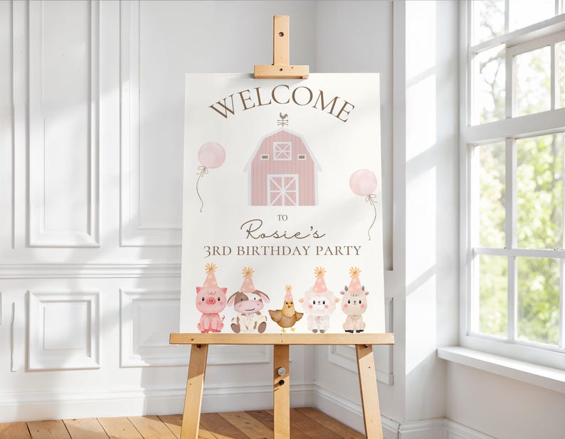 May include: A wooden easel displays a party sign with the word "WELCOME" above a pink barn illustration. The sign welcomes guests to "Rosie's 3rd Birthday Party" and features cartoon farm animals and balloons.