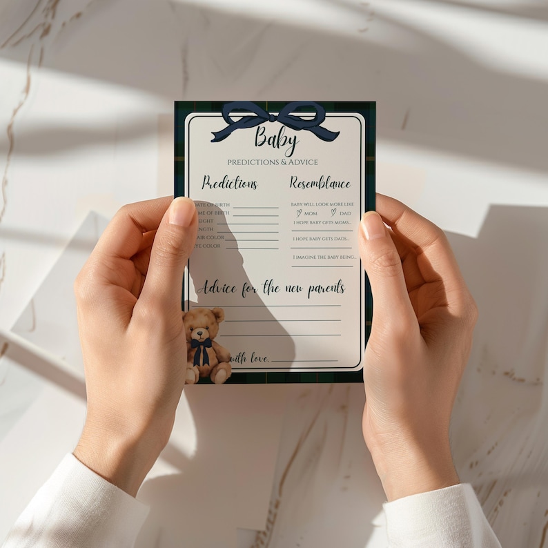 May include: A baby shower game card featuring a navy blue bow and a plaid border. The card is designed for predictions and advice, with a small teddy bear illustration. Text on the card reads "Baby Predictions & Advice".
