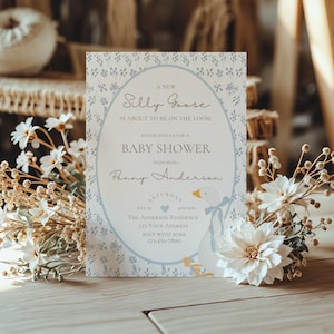 May include: A blue and white baby shower invitation with a goose illustration and the text "A New Silly Goose is About to Be on the Loose. Please Join Us for a Baby Shower Honoring Penny Anderson."