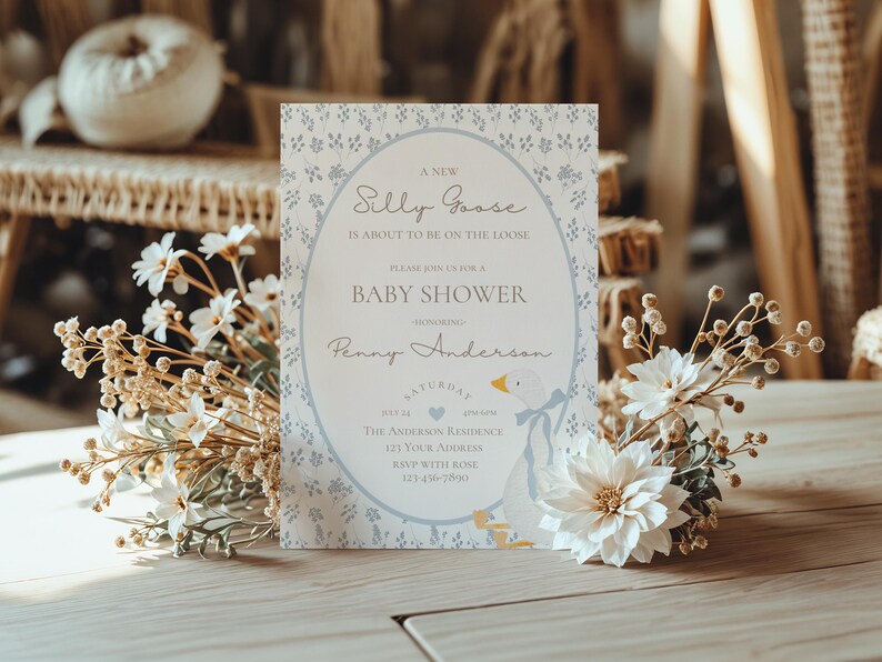 May include: A blue and white baby shower invitation with a goose illustration and the text "A New Silly Goose is About to Be on the Loose. Please Join Us for a Baby Shower Honoring Penny Anderson."