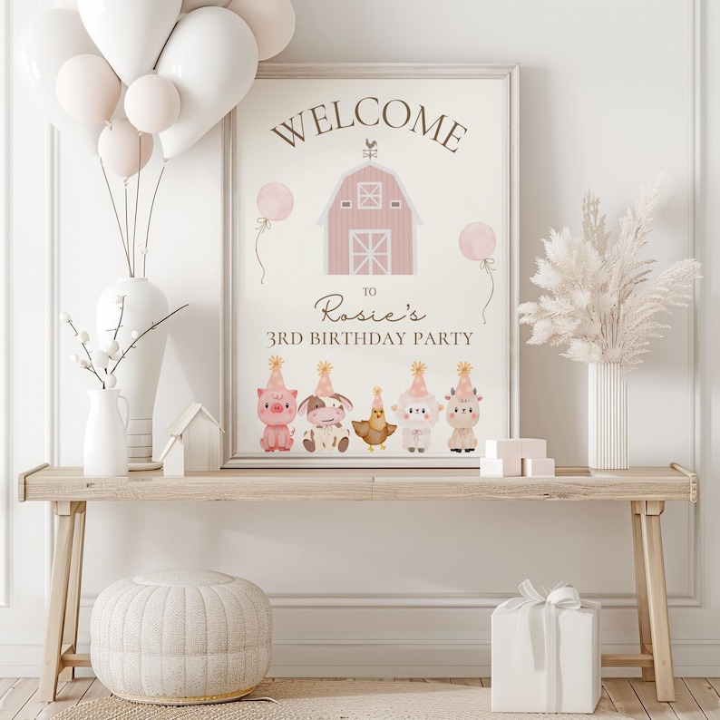 May include: A framed sign with the words "WELCOME" and "Rosie's 3rd BIRTHDAY PARTY" above cartoon farm animals. The sign is on a wooden table with balloons, vases, and a gift box. The color scheme is soft pink and white.