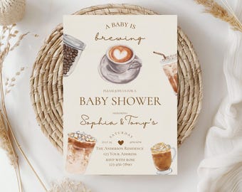 May include: A baby shower invitation with a coffee theme. The invitation is beige with brown text and illustrations of coffee cups and coffee beans. The text reads "A baby is brewing, Please join us for a baby shower, Sophia & Tony's, Saturday, July 24, 4:00-6:00pm, The Anderson Residence, 123 Your Address, RSVP with Rose, 123-456-7890."