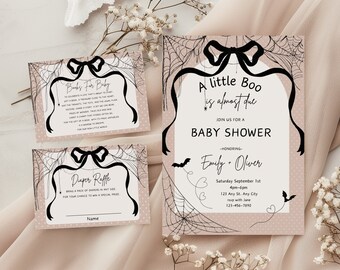 May include: A pink and black baby shower invitation with a spiderweb design and the text "A little Boo is almost due". The invitation includes the date, time, and location of the shower, as well as the names of the parents-to-be, Emily and Oliver.