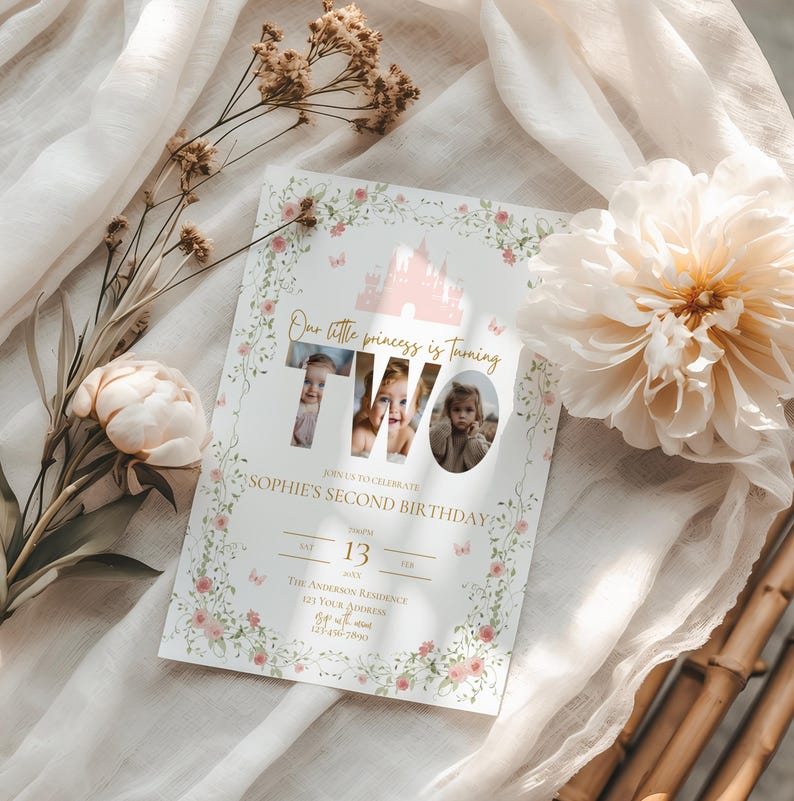 May include: A custom invitation for a second birthday celebration. The invitation features a pink castle illustration, floral accents, and the text "Our little princess is turning TWO". The invitation includes the date, time, and location of the party.