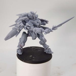 May include: A gray plastic miniature robot figure with a sword and wings. The robot is standing on a black base.