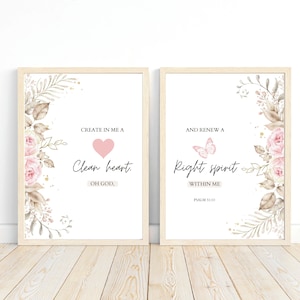 May include: Two framed prints with floral designs and inspirational quotes. The left print features a pink heart and the text "CREATE IN ME A Clean heart. OH GOD,". The right print features a pink butterfly and the text "AND RENEW A Right spirit WITHIN ME PSALM 51:10".