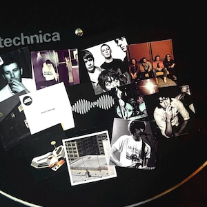 May include: A collage of images featuring the band Arctic Monkeys. The images include album covers, band photos, and a photo of a building. The album covers include "Suck It and See" and "AM".