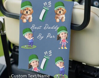 May include: A blue golf towel featuring cartoon illustrations of a puppy, children playing golf, and golf bags. The text "Best Daddy By Par" and "Custom Text/Name" are also displayed on the towel.