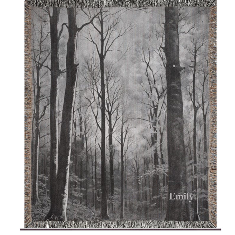 May include: Black and white woven tapestry featuring a forest scene with tall trees and a misty background. The tapestry has a fringe border and the word "Emily" is printed in the bottom right corner.