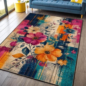 May include: A rectangular area rug featuring a vibrant abstract design with bold vertical stripes in shades of deep blue, bright orange, and magenta. Large, detailed floral illustrations in yellow, pink, and blue are layered over the pattern.