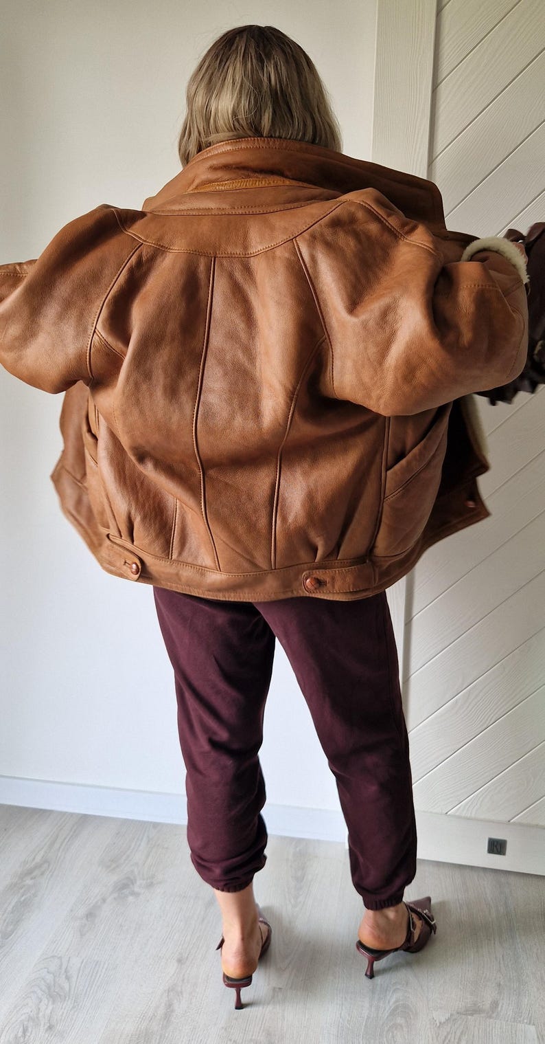 Back view of Shearling Original jacket showing natural camel cinnamon sheepskin leather texture.