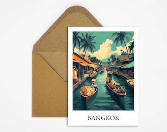 May include: A postcard with a colorful illustration of a canal market in Bangkok, Thailand. The image shows boats filled with fruit and vegetables, with people paddling down the canal. The postcard has the word "BANGKOK" printed at the bottom.