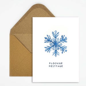Weihnachtskarte Schneeflocke - Stilvolle Weihnachtsgrüße mit winterlichem Flair und charmantem Wortspiel 'Flockige Festtage' zum Verschenken