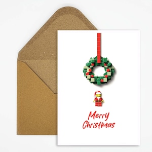 Kerstkaartbouwsteenkrans met Kerstman, perfecte wenskaart voor bouwsteenfans en feestelijke decoratie voor Kerstmis