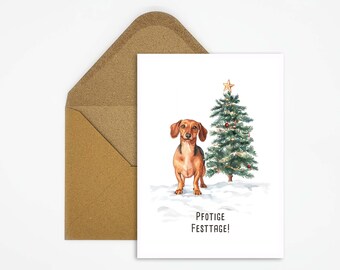 Vykort med en tax och en julgran med texten "Paw-tastic Holidays!". Ett julkort för julhälsningar med djurtema, perfekt som present eller dekoration.