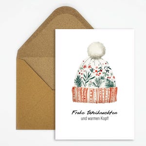 Tarjeta navideña con motivo de gorro de invierno, elegantes felicitaciones navideñas con el texto "Feliz Navidad y una cabeza cálida" como regalo