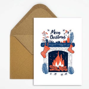Acogedora tarjeta navideña con motivo de chimenea y medias: ¡felicitaciones navideñas perfectas para unas cálidas vacaciones! Tarjeta con dicho de feliz Navidad.