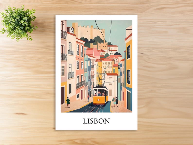 May include: A colorful illustration of a street scene in Lisbon, Portugal. The image features a yellow tram traveling up a hill lined with colorful buildings. The text "LISBON" is printed at the bottom of the image.