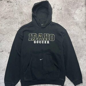 May include: Black hooded sweatshirt with a white "IDAHO SOCCER" graphic on the front. The sweatshirt has a white Nike swoosh logo on the left chest and a white Nike swoosh logo on the front pocket.