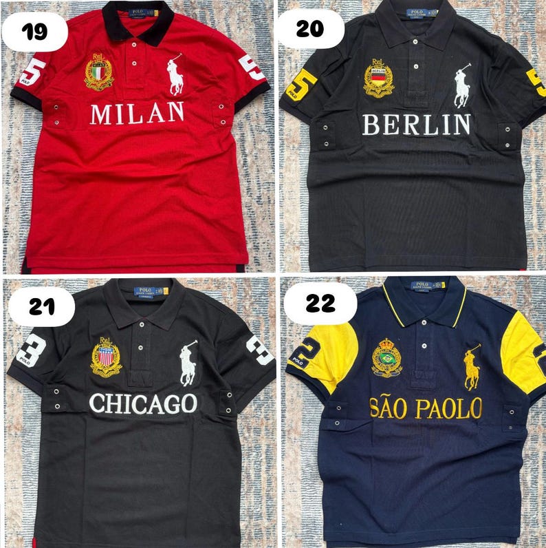 May include: Four polo shirts in red, black, and navy blue. Each shirt features a city name: Milan, Berlin, Chicago, and S&atilde;o Paulo. The shirts have a collared neckline, short sleeves, and a logo of a person on a horse.