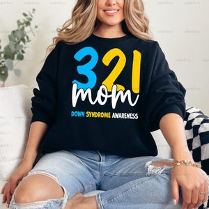 May include: Black sweatshirt with a yellow and blue graphic that says "321 mom" and "Down Syndrome Awareness".