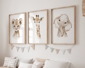 May include: Three watercolor animal prints in wooden frames, featuring a lion, giraffe, and elephant. The prints are hung on a white wall above a wooden bench with storage bins and pillows.