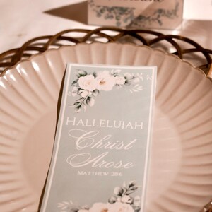 May include: A light blue card with white flowers and the text "Hallelujah Christ Arose Matthew 28:6".