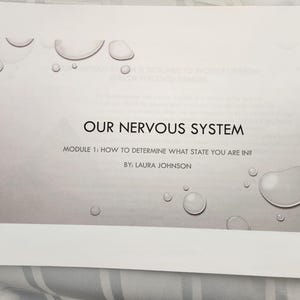 May include: A white paper with the title "OUR NERVOUS SYSTEM" in black text. The paper also includes the text "MODULE 1: HOW TO DETERMINE WHAT STATE YOU ARE IN?" and "BY: LAURA JOHNSON". The background has a gradient and water droplet graphics.