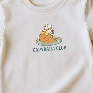 Capybara Club Shirt – Cute Cartoon Capybara in Hot Spring with Ducks – Aesthetic Animal Tee – Funny Chill Gift for Pet or Nature Lovers