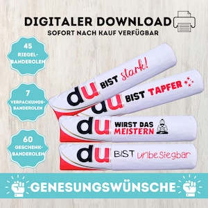 May include: Three white tubes with red and black accents. Each tube has a different message: "Du bist stark!" (You are strong!), "Du bist tapfer!" (You are brave!), and "Du wirst das meistern!" (You will master this!). The tubes are labelled with the number of banderoles included: 45, 7, and 60. The image also includes the text "Genesungswünsche" (Get well wishes).