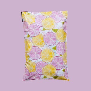 May include: A handmade, wooden cutting board with a natural finish. The board features a live edge on one side and a smooth, rectangular shape. It is approximately 18 inches long and 12 inches wide.