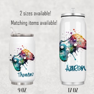 May include: Two stainless steel water bottles with a colourful watercolour design of a video game controller. The smaller bottle is 9 oz and says "Thomas" on it. The larger bottle is 17 oz and says "Aaron" on it.