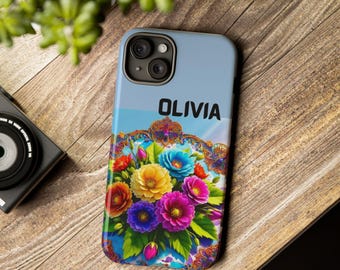 May include: A phone case with a floral design and the name "Olivia" printed on it. The case has a blue background with a white border and a floral design in the center. The flowers are in shades of pink, blue, yellow, and purple.
