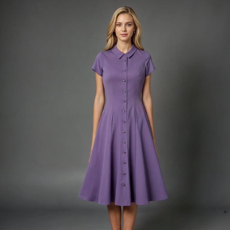 May include: A purple button-down dress with short sleeves and a flared skirt.