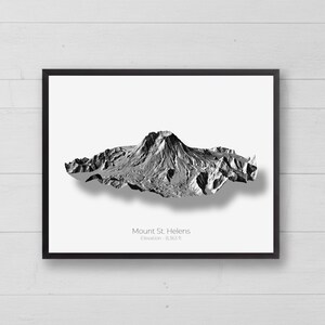 May include: A framed black and white print featuring a 3D topographical relief map of Mount St. Helens. The text below the mountain reads Mount St. Helens and Elevation - 8,363 ft. The artwork is presented in a simple black frame.