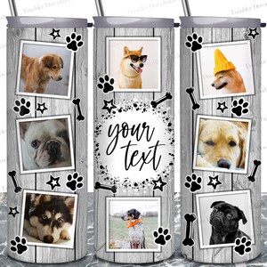 May include: A white tumbler with a gray woodgrain background. The tumbler has a variety of images of dogs in different poses, including a dog wearing sunglasses, a dog wearing a hat, and a dog with its tongue sticking out. The tumbler also has black paw prints, stars, and bones. The text "your text" is written in black on the tumbler.