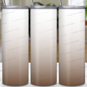 May include: Three stainless steel tumblers with a gradient design. The tumblers are white at the top and transition to a brown color at the bottom. The tumblers are arranged in a row on a white surface.