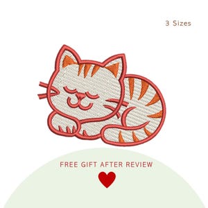 May include: An embroidered design of a sleeping cat with orange stripes and a red outline. The text "3 Sizes" is above the cat. Below the cat is a green shape with the text "FREE GIFT AFTER REVIEW" and a red heart.