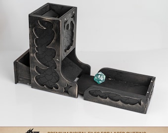 May include: A black wooden dice tower with a distressed finish and intricate dragon scale cutouts on the sides. The tower features an attached tray at the base containing a single teal twenty-sided die. The text 2Z CREATIVE LAB is visible.