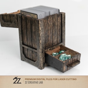 May include: A wooden card and dice storage box with a rustic, weathered appearance. The box has a drawer containing several green dice and a compartment filled with a deck of cards. The box is made of dark brown wood and has a textured surface.