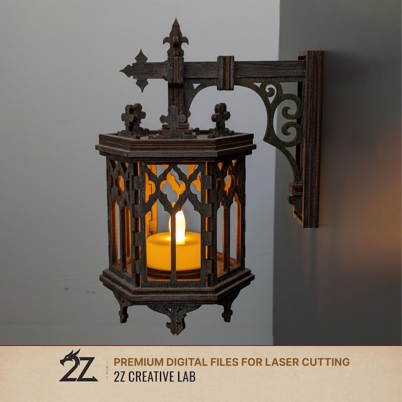May include: A dark brown, gothic-style wall-mounted lantern with an ornate design. The lantern features a lit, yellow candle inside. The design includes decorative cutouts and a cross-shaped top. The text "PREMIUM DIGITAL FILES FOR LASER CUTTING" and "2Z CREATIVE LAB" is visible.