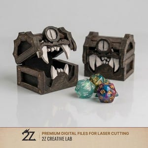 May include: Two dark brown wooden mimic chests with white teeth and a single central eye, one open and one closed, accompanied by three multi-colored polyhedral dice. The text 2Z PREMIUM DIGITAL FILES FOR LASER CUTTING 2Z CREATIVE LAB is visible.