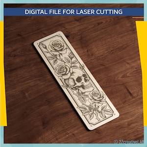 May include: A rectangular bookmark with a laser-cut design featuring a skull and roses. The bookmark has a light-coloured background with a dark outline. The text "DIGITAL FILE FOR LASER CUTTING" is at the top.